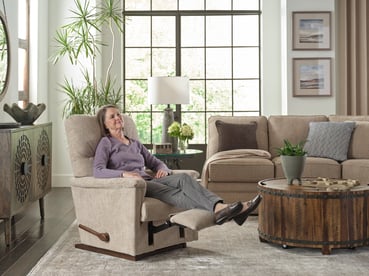 woman enjoying the collage recliner from la-z-boy