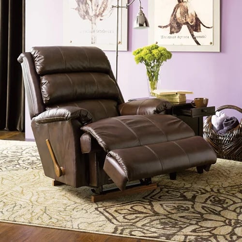 brown leather astor recliner with wood handle on rug