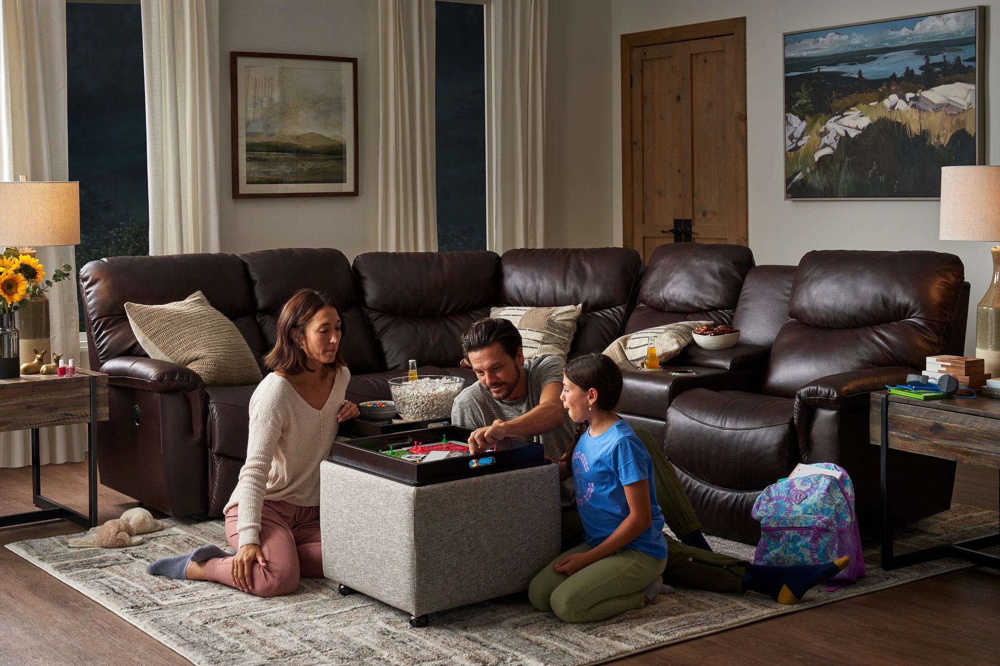 family enjoying games with their leather furniture