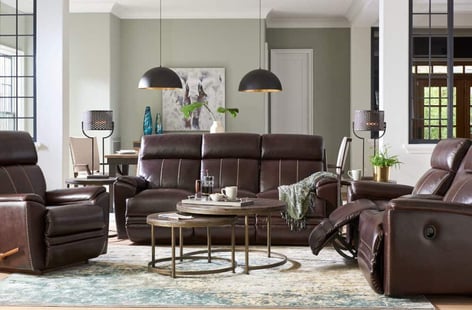 leather reclining sofa and loveseat in living room 