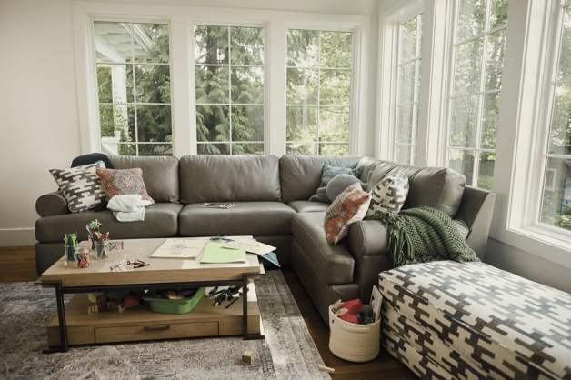 leather sectional couch with coffee table in living room