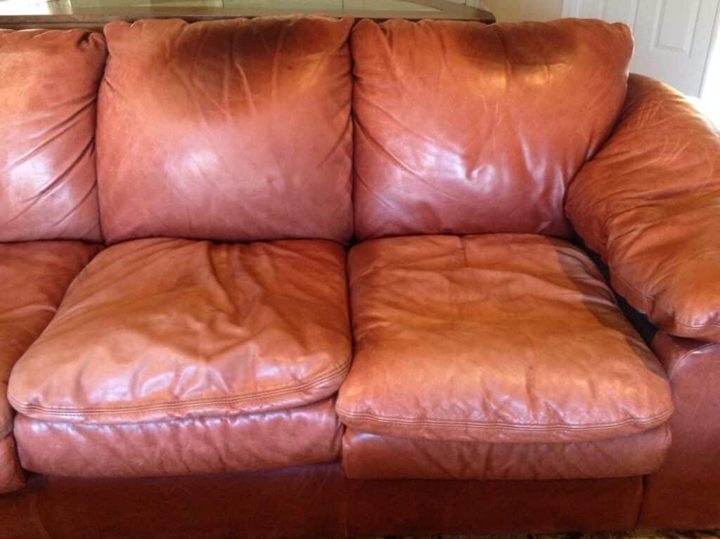 leather sofa with body oil damage