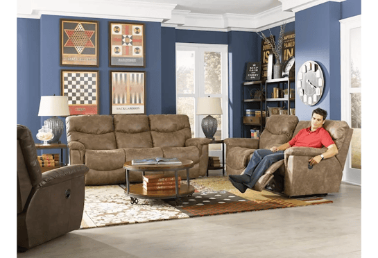 man enjoying james reclining loveseat in living room