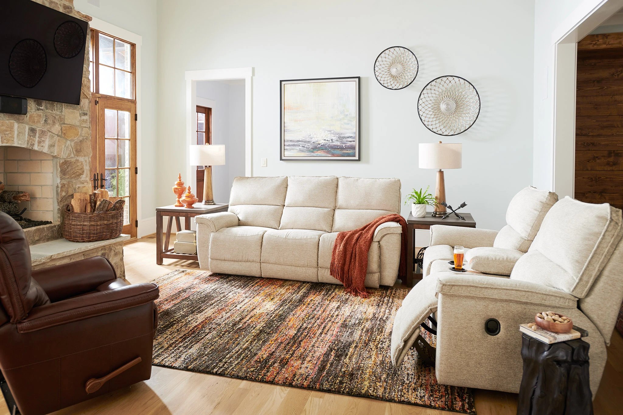 reclining loveseat with cupholder in decorated living room