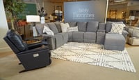 rocker recliner and sofas in furniture showroom