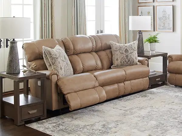 tan leather reclining sofa with coffee table