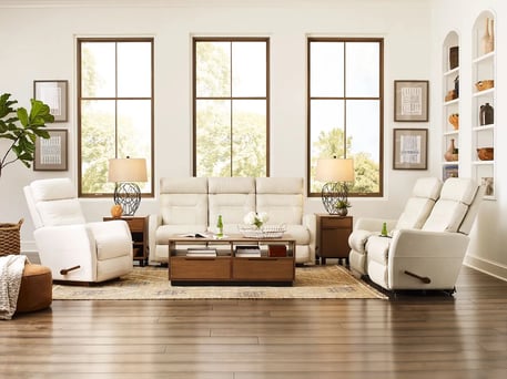 white lennon rocking recliner in bright living room with wood floors