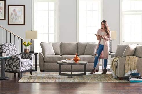 woman using ipad to shop for furniture online