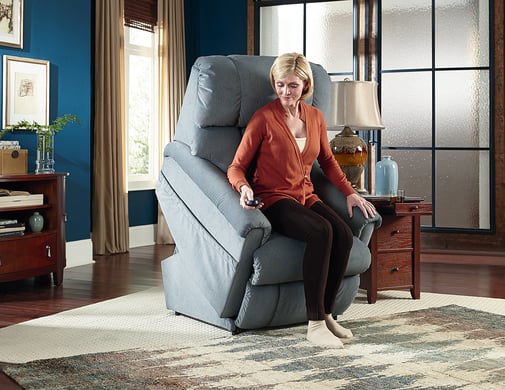 woman using la-z-boy power lift recliner