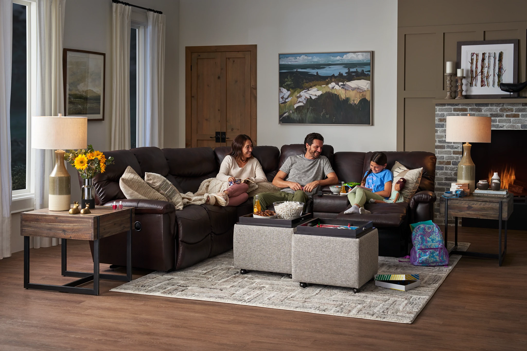 family enjoying la-z-boy brown leather sectional 